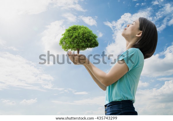 Women With A Tree In Hand She Was Breathing Oxygen In Pure Nature Vast Blue Sky And Cloud Background Clipping Path