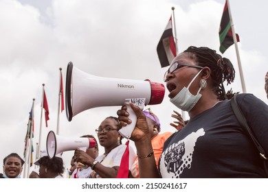 Women trying to make there voices heard using a megaphone - Lagos, NIGERIA, March 8 2022. 