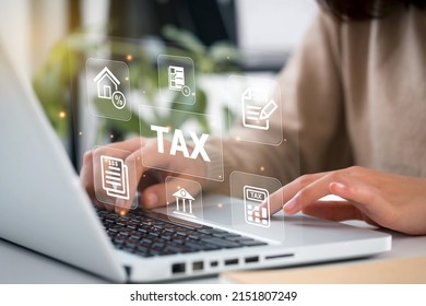Women use the laptop to fill in the income tax online return form for payment. Government, state taxes. Data analysis, paperwork,Financial research, government taxes, Tax, and Vat concept.