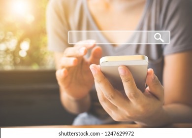 Women use smartphones to find what they are interested in. Searching information data on internet networking concept - Shutterstock ID 1247629972