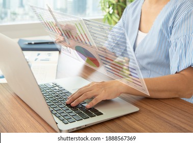 women using laptop computer with financial report spreadsheet virtual screen interface for business and marketing research evaluation performance.
