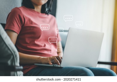 Women Using Laptop Computer Typing On Keyboard With Chat Box Icon, Live Chat Chatting.Web And Social Network Concept.
