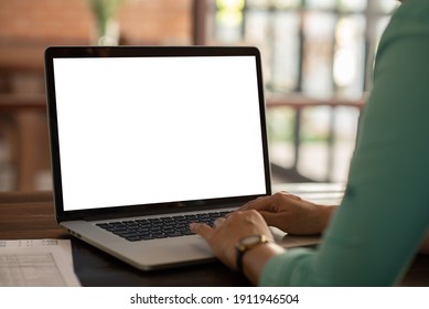 Women Using Laptop Computer Working At Home With Blank White Desktop Screen. Laptop Mockup.