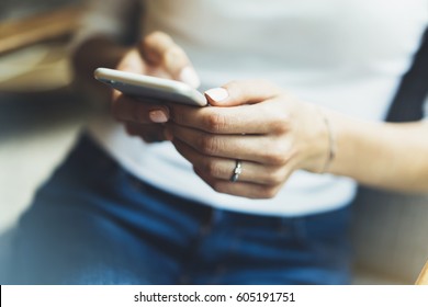Women using smart phone isolated, hipster manager holding mobile gadget, girl text message, connect concept, blur background mock up, female hands touch digital screen, user social network - Shutterstock ID 605191751