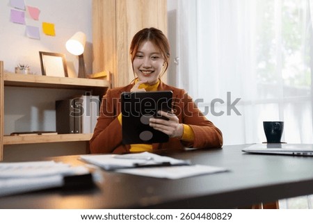 Women are using tablet to work.
