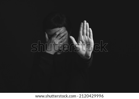 depressed man closes his eyes with his hands