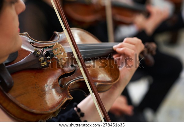 Women Violinist Playing Classical Violin\
Music in Musical\
Performance