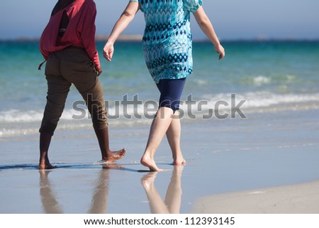 Similar – Little girl running with women on beach