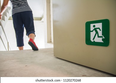 Women Walking To The Emergency Fire Exit Door