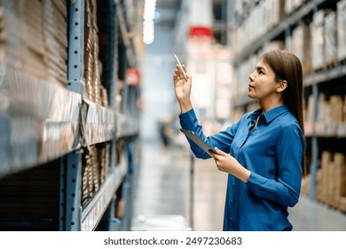 Women warehouse staff using digital tablets to check the stock inventory on shelves in large warehouses, a Smart warehouse management system, supply chain and logistic network technology concept. - Powered by Shutterstock