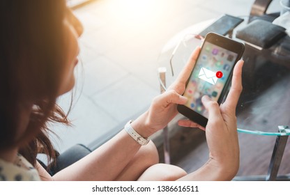 Women Are Watching The Smartphone Because They Have Received Inbox Email, New Messages On Mobile Smartphone.