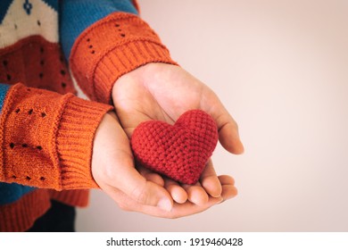 Women Wear Knit Shirt Hand Holding Red Heart. Concept Of Love, Hope, Happy Valentine, Healthcare,organ Donation,insurance, Medical, World Heart Day, National Organ Donor Day,World Mental Health Day.