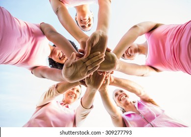 Women Wearing Pink For Breast Cancer And Putting Hands Together In Parkland