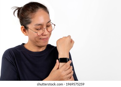 Women Wearing Smartwatches On The Wrist Isolated On White Background. For Exercise To Watch Heart Rate, Step Count, And Watch The Time.