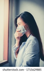 Women who have a cough and are sick with a flu infection,  covid-19, coronavirus, therefore have to use masks to cover the mouth and nose. - Shutterstock ID 1715629885