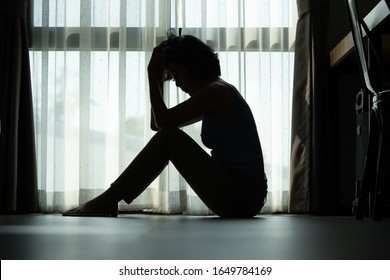 Women who are heartbroken from love are sad, women are worried and stressed, Women sit with knees with seriousness. - Shutterstock ID 1649784169