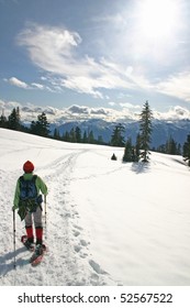 Women In The Winter Snow Shoe Hiking.