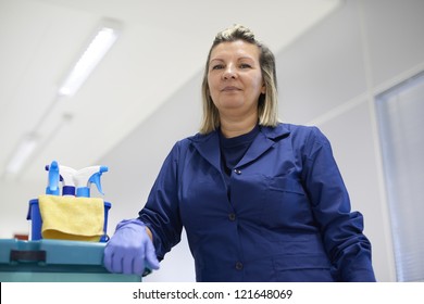 Women At Work, Portrait Of Happy Professional Female Cleaner Smiling And Looking At Camera In Office. Low Angle View