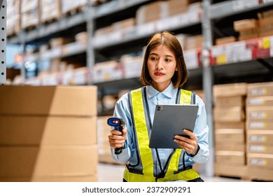 Women worker use scanner to check and scan barcodes of stock inventory on shelves to keep storage in a system, Smart warehouse management system, Supply chain and logistic network technology concept. - Powered by Shutterstock