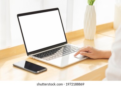 Women Working On Her Laptop With Blank Copy Space Screen For Your Advertising Text Message In Office, Back View Of Business Women Hands Busy Using Laptop At Office Desk.