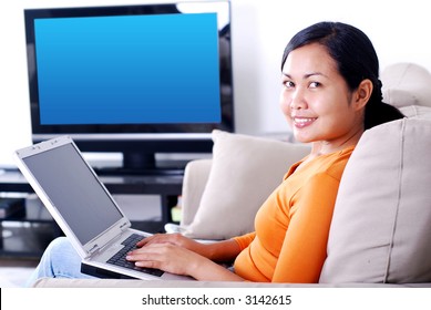 Women Working On Laptop In The Living Room