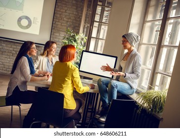 Women At Workplace Presents Ideas One To Another For New Business