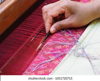 Women works on cotton or silk weaving with traditional hand weaving loom. - Shutterstock ID 1051720715