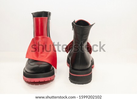 women's black boots with red accents