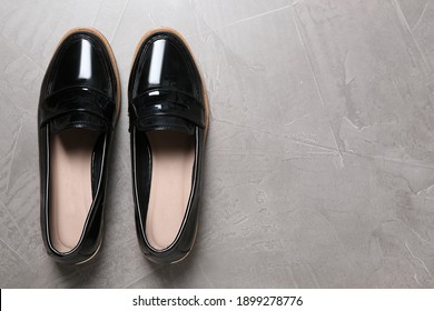 Women's Black Shoes On Grey Background, Top View. Space For Text