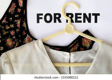 Women's blouses on the words FOR RENT. Design concept for clothing rental where customers can expand their wardrobe by renting a wide selection of clothes and branded designer apparels on a budget.
