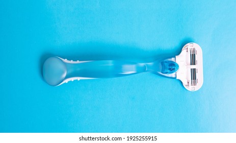 Womens Blue Razor On A Blue Background Close Up