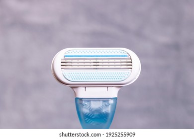 Womens Blue Razor On A Gray Background Close Up