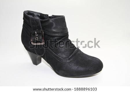 Women's boots. Short-throated. On a white background. Side view.