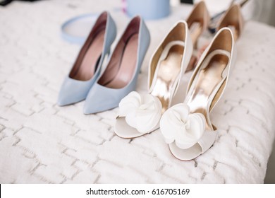 Women's Casual And Luxurious Shoes. Women's Shoes On The Bed. So Many Different Shoes.