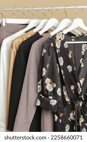 Women's Clothes. Close up image of clothes rack with stylish and elegant clothes in fashion atelier. Minimalist fashion blog concept. - Shutterstock ID 2258660071