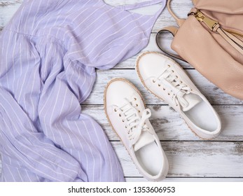 Womens Clothing, Shoes, Accessories (lavender Dress, White Leather Sneakers, Beige Backpack). Fashion Outfit, Spring Summer Collection. Shopping Concept. Flat Lay, View From Above