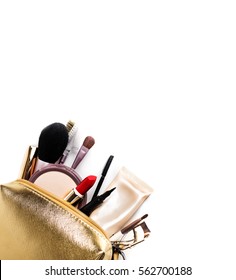 Women's Cosmetics. Gold Cosmetic Bag With A Set Of Cosmetics To Create A Make-up On A White Background. Copy Space.