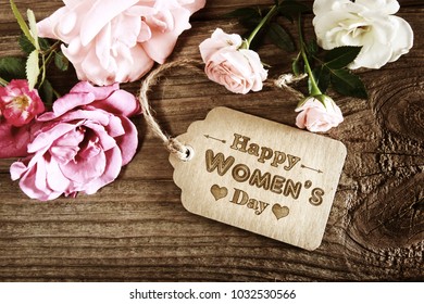 Womens Day message with rustic pink roses on wooden table - Shutterstock ID 1032530566