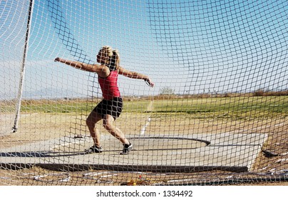 Women's Discus Competition At A College Track Meet.