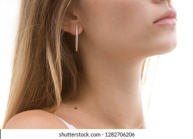 women's earrings with stones, jewelry, earrings at the ear of a beautiful girl, women's accessories, gold earrings, earrings with stones - Shutterstock ID 1282706206