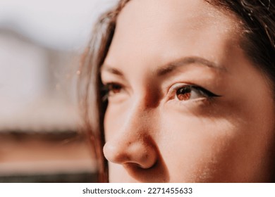 Women's eyes banner. Close up portrait of happy young caucasian woman with freckles at sunset time. Cute woman portrait. - Powered by Shutterstock