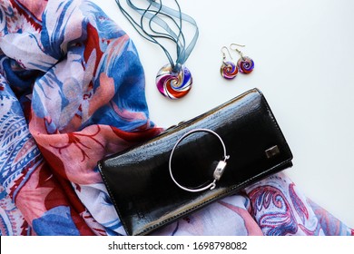 Women's fashion and style. Fashionable women's accessories. handbag, scarf, original jewelry. pendant, earrings and rings
