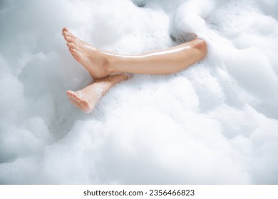 Women's feet she was happily bathing in a bathtub. - Powered by Shutterstock