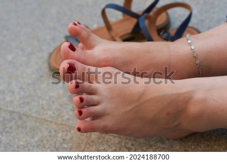 women's feet, toes, red pedicure