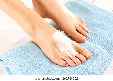 Women's Feet.Beautiful Slim Female Feet Located On The Towel