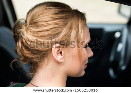 Women's festive hairstyle, hair pulled up and pinned back