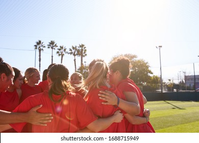 Womens Football Team In Huddle Having Motivational Pep Talk Before Soccer Match