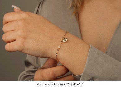 women's gold bracelet on girl's hand, women's accessories, jewelry, gold bracelet with stones, women's jewelry, girl bracelet on her arm, gold bracelet with stones