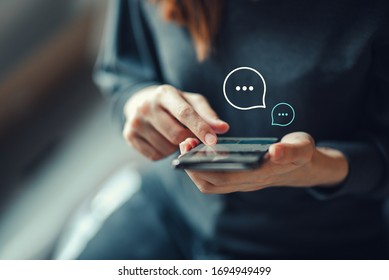 Women's hand typing on mobile smartphone, Live Chat Chatting on application Communication Digital Web and social network Concept. Work from home. - Shutterstock ID 1694949499