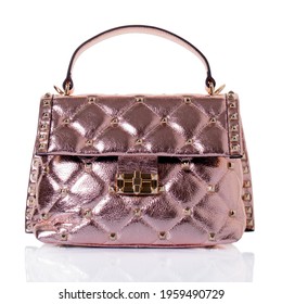 Women's Handbag Made Of Genuine Leather In Pink Color With A Metallic Effect. Model With One Handle, Decorated With Gold Rivets. On A White Background